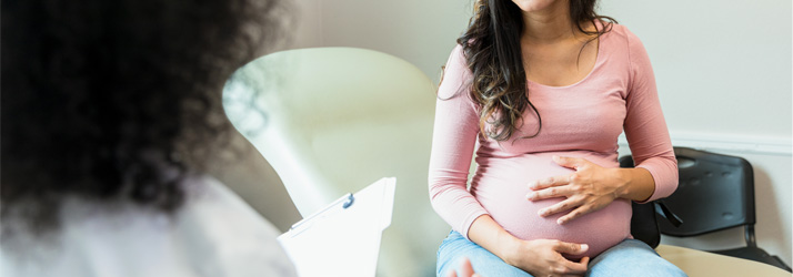Pregnant women in doctors office